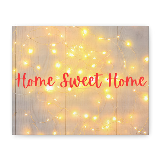 Wooden wall art with 'Home Sweet Home' text and string lights on a white background