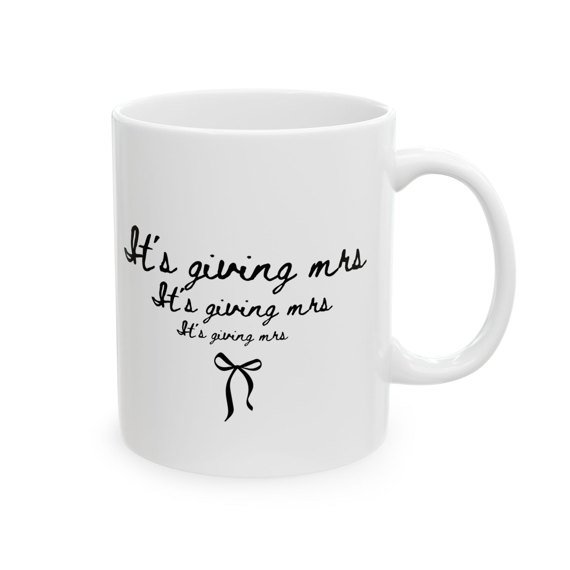 White mug with black text and bow design on a white background