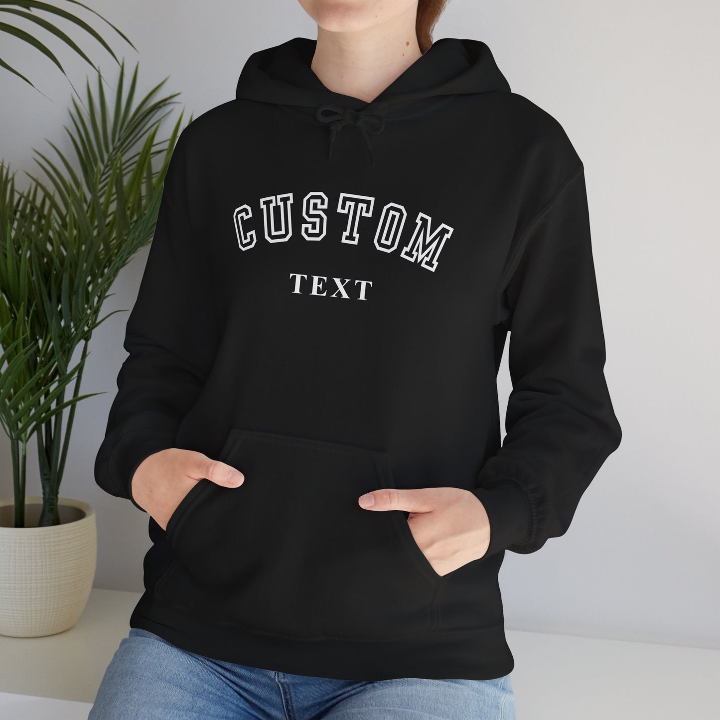 Person wearing custom text sweatshirt with kangaroo pocket